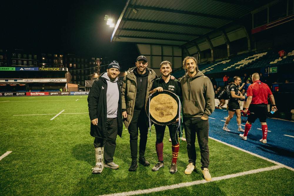 Last year's winners with the barrel-lid trophy